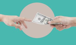 An exchange of money between two hands