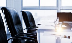 An empty table prepped for a business meeting