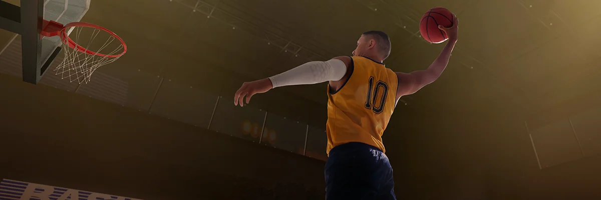 Basketball player preparing to shoot near the hoop in an indoor arena